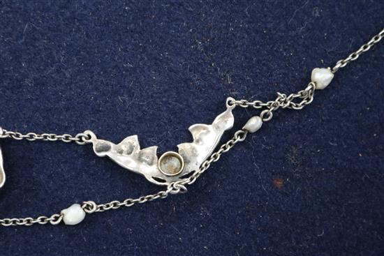 An early 20th century Art Nouveau white metal, enamel and seed pearl necklace, approx. 40cm.
